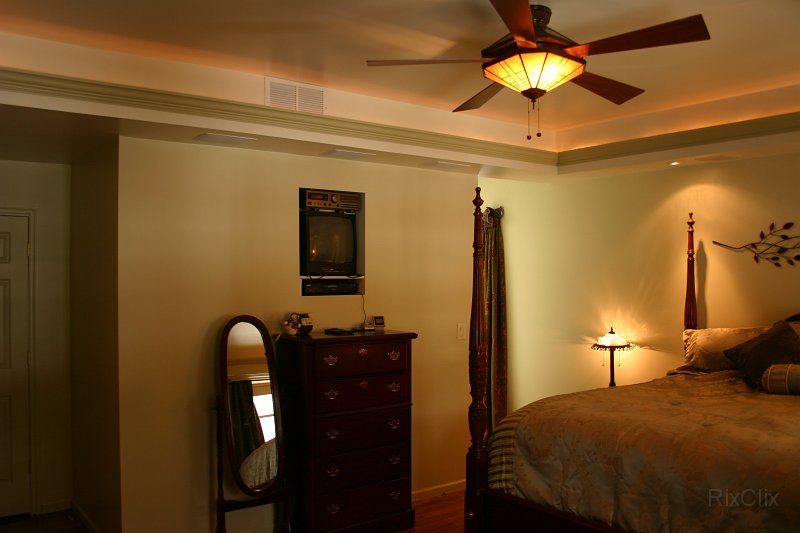 BHG 009.jpg - The tray ceiling is trimmed with cove molding and rope lighting behind it.